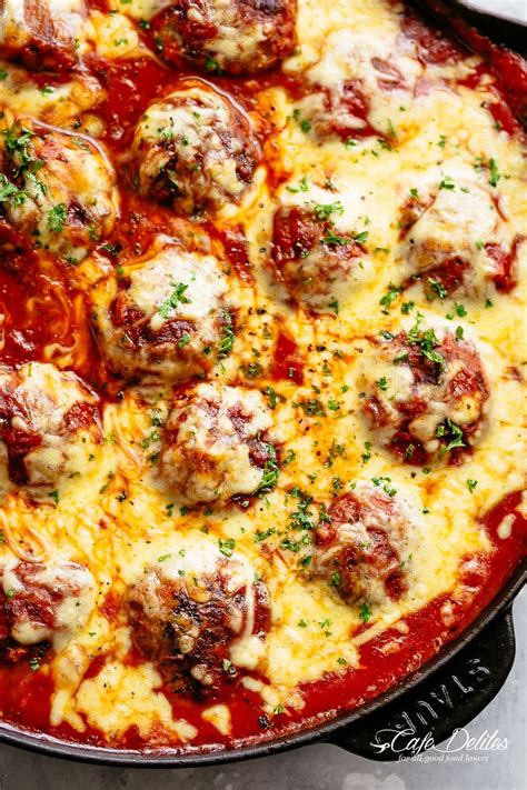 Cheesy Meatballs Are Juicy And Tender Simmered In Tomato Sauce And Topped With Melted Cheese