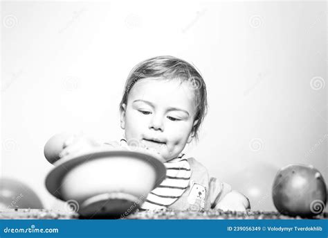 Cute Funny Babies Eating Baby Food Funny Kid Boy With Plate And Spoon