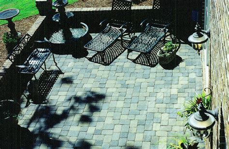 Tumbled Cobblestone Concrete Paver Patio With Brick Seating Bench Wall