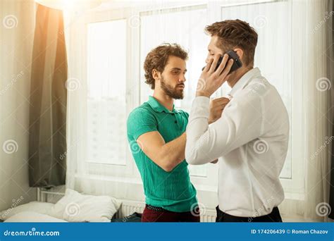 Side View On Businessman Talking On Phone And Same Sex Gay Man Stock