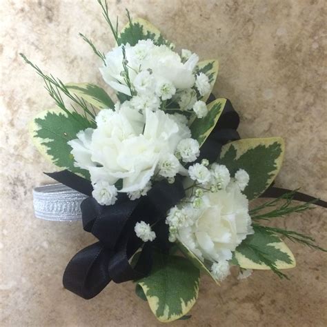 White Mini Carnations With Babys Breath And Black Ribbon Corsage
