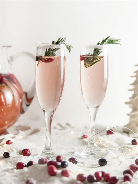 An easy way to serve drinks to your whole crew, all at once. Christmas Cranberry Champagne Cocktails - Seasoned Sprinkles