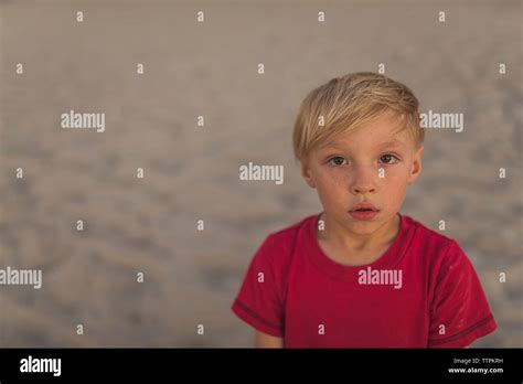 Portrait Of Boy Standing At Beach Stock Photo Alamy