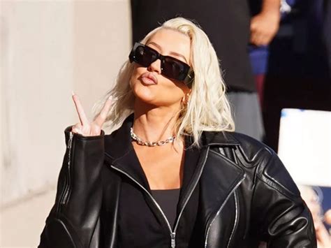 Christina Aguilera Shines In Thigh High Leather Stilettos And A Super Miniskirt