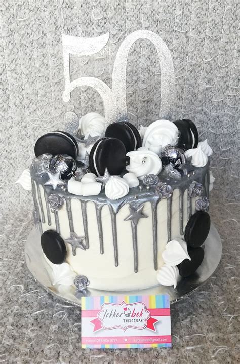 The description of cake design for man app. 50th birthday cake with white buttercream frosting and ...