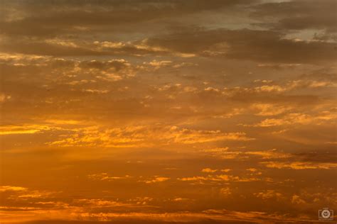 Orange Sunset Sky And Clouds Background