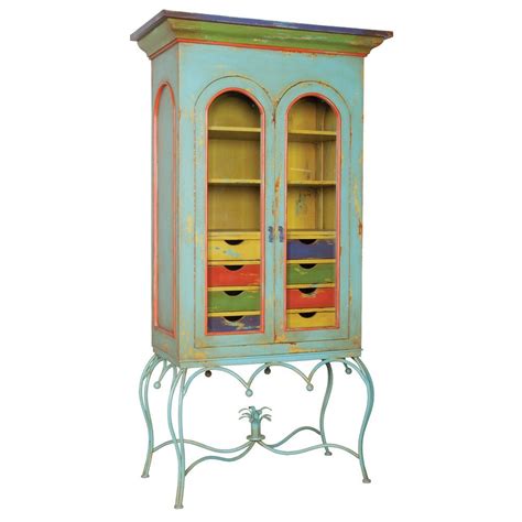 In fact, installing mismatched, multicolored cupboards—as joy cho, susan alexandra, and george glasier have done—is a relatively easy way to make a major impact in the room where you probably spend most of your time gathering. Multi-Colored Display Cabinet | Display cabinet, Elk home ...