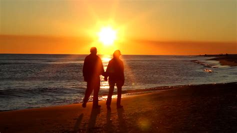 Couple Walking Along Summer Beach At Sunset Stock Footage Video 2526950