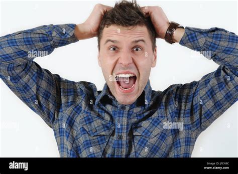 Emotional Portrait Of Young Angry Screaming Man Pulling His Hair Human