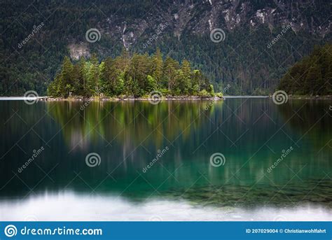 Colorful Reflection Of Sasseninsel Island Located At Eibsee Lake In The