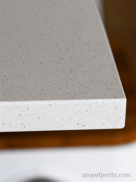 Engineered quartz is a special composite that is made from crushed quartz bound together by an adhesive. Quartz Countertops: Caesarstone vs Granite - A Pop of ...