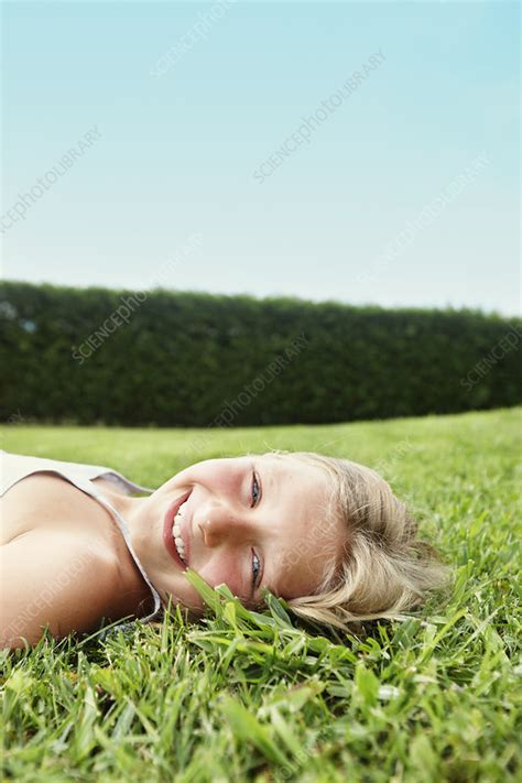 Smiling Girl Laying In Grass Stock Image F0049703 Science Photo Library