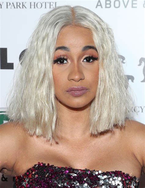 Cardi b short afro hairstyle is giving bald look without any difficulty. Cardi B Medium Wavy Cut - Cardi B Looks - StyleBistro