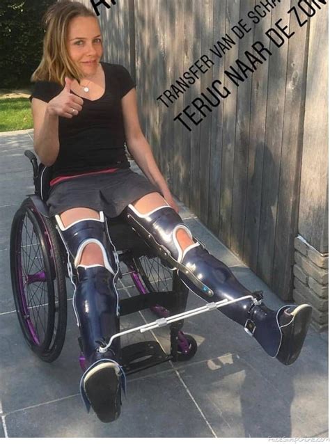 A Woman Sitting In A Wheel Chair With Knee Braces