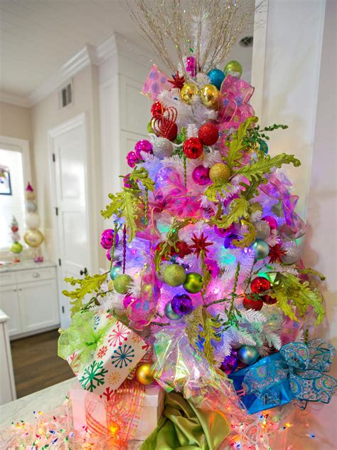 I love this silver and white tree decorated with beautiful sparkly glitter wood letter garland, white snowflakes, silver ornaments and a big silver, glittery bow topper. The 50 Best and Most Inspiring Christmas Tree Decoration ...