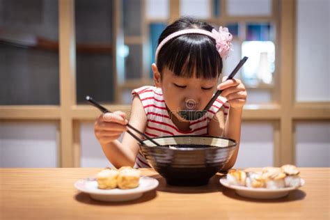 Asian Little Chinese Girl Eating Ramen Noodles Stock Photo Image Of
