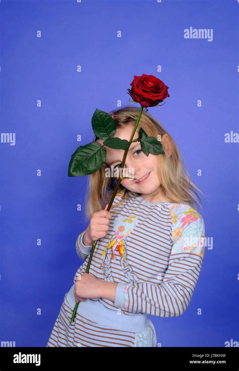 Little Girl With Red Rose Stock Photo Alamy