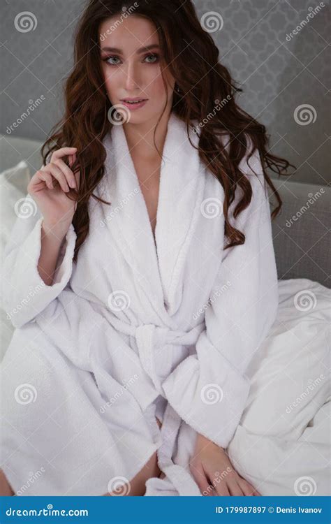 Beautiful Brunette In White Robe Sitting On The Bed Stock Image Image Of Blanket Leisure