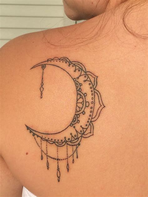 A unique meaning often attached to the crescent moon tattoo is moody.. Mehndi and mandala inspired crescent moon tattoo piece ...