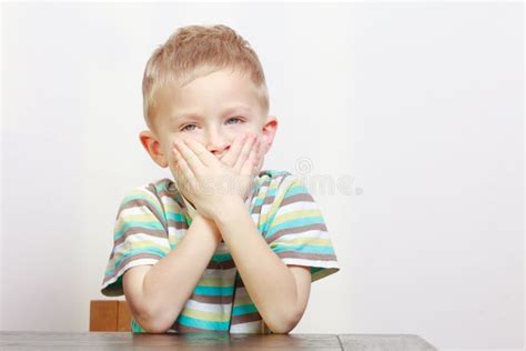 Sleepy Tired Boy Child Kid Yawning Covering Mouth At Home Stock Photo
