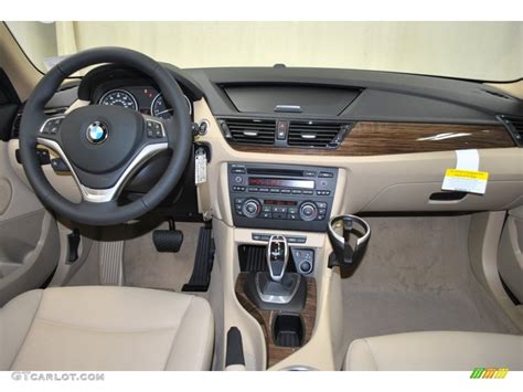 The bmw x1 xdrive28i is available in only one trim level that has a base price of $34,800. 2013 BMW X1 sDrive 28i Beige Dashboard Photo #73982229 | GTCarLot.com