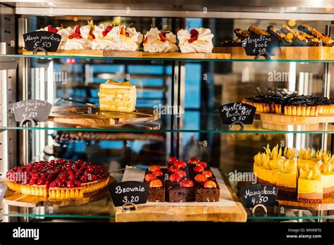 Pastry Shop Glass Display With Selection Of Sweets And Cakes Stock