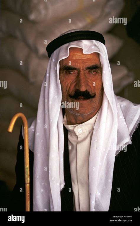An Old Man Wearing Traditional Arab Dress Of A Keffiyeh Kufiya And A