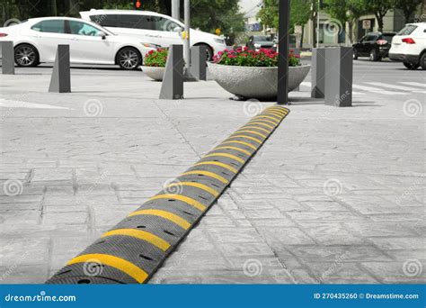 City Street With Striped Plastic Speed Bump Stock Photo Image Of