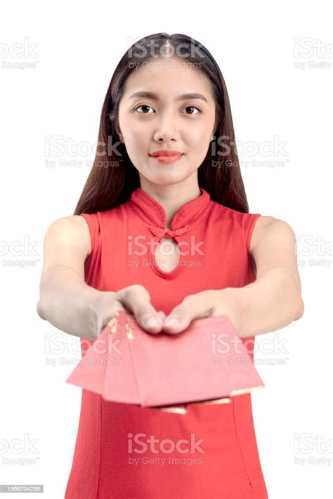 Asian Chinese Woman In A Cheongsam Dress Giving Red Envelopes Stock