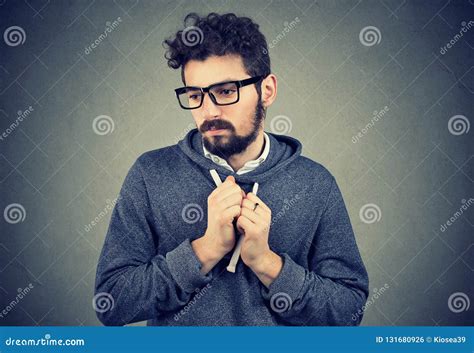 Young Man Pointing Feeling Shy And Guilty In Awkward Situation Stock