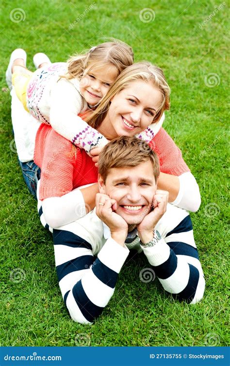 Husband Wife And Child Piled On Each Other Stock Image Image Of