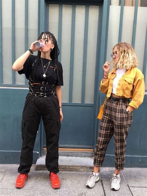 Two Young Women Dressed In 90s Grunge Fashion One Wearing A Black