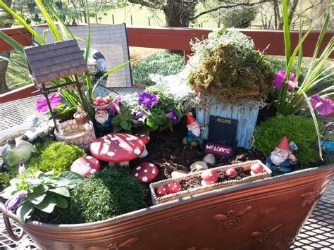 Beautiful colors and details, right down to fairy cottage swinging doors. House made from craft sticks, the rest from Hobby Lobby.this makes me happy | Fairy garden ...