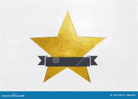 Bright Yellow Star On A Wooden White Background With Space For