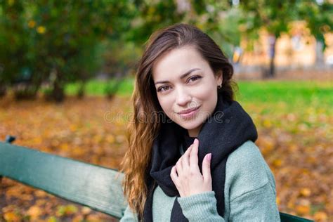 Beautiful Girl Sitting On A Bench Sunny Autumn Day In The Park Relaxing Portrait Of Stylish