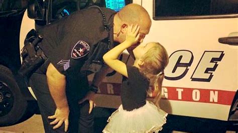 policeman dad kisses ballerina daughter goodbye in whyiwearthebadge viral photo