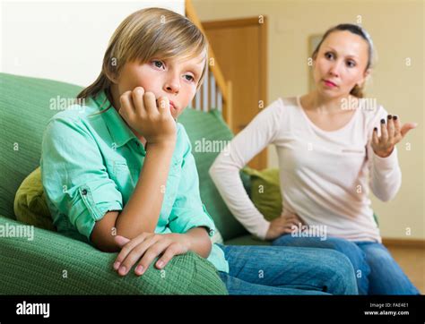Angry Mother Scolding Naughty Teenage Son In Home Interior Focus On