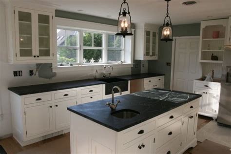 Also, remove the drawers and empty them to put them aside. Kitchen Cabinet White Paint and Black Laminate Countertops ...