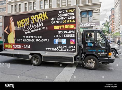 a mobile ad for a strip club on a truck on west 14th street in lower manhattan new york city