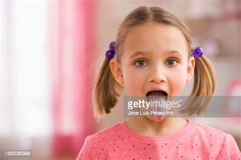 Mixed Race Girl Sticking Out Tongue Photo Getty Images