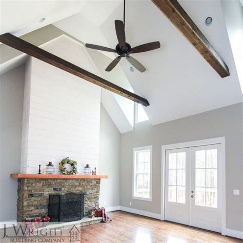 This look was made popular by joanna gaines and gives the. Shiplap and rock fireplace with vaulted ceiling beams # ...