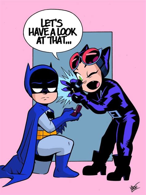 Batman And Catwoman Talking To Each Other In Front Of A Mirror With The