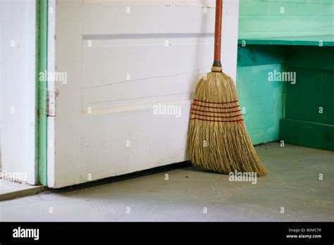 A Broom Standing Against A Door Stock Photo Alamy