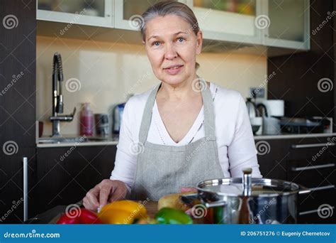 Mature Woman In Kitchen Preparing Food Stock Photo Image Of Aged