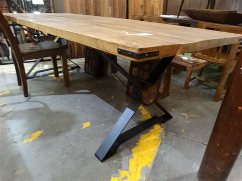 We did not find results for: Wood and Iron Dining Table features a wood top and a black ...