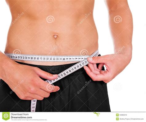 Measuring your waist circumference is a good way to tell. Man Measuring His Waistline Stock Image - Image of fist ...