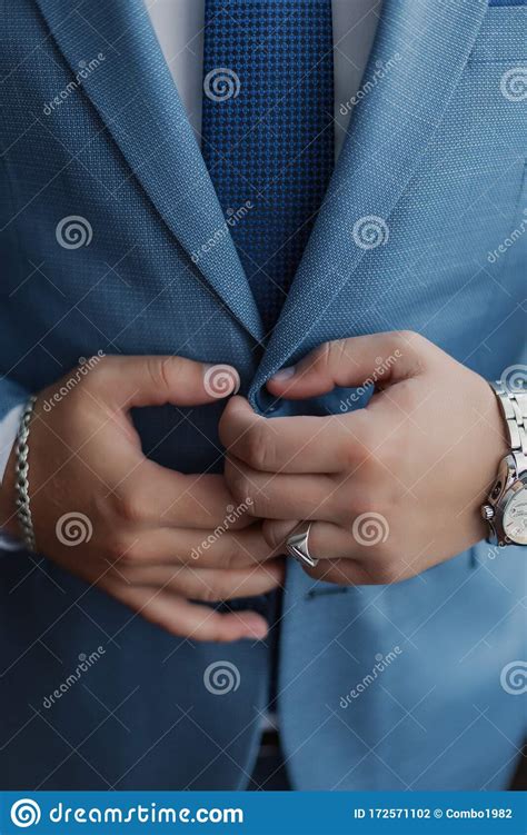 A Man And A Successful Businessman Straightens His Jacket Stock Photo