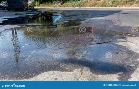 Accident Of Water Supply Sewerage Water Flows From Hatch Of Road