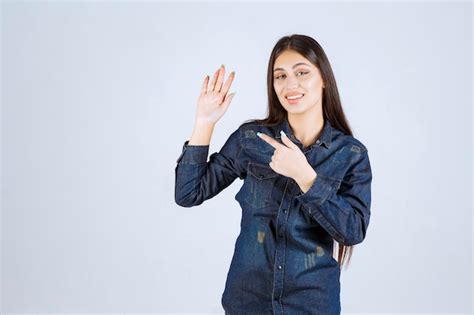 Free Photo Young Woman Raising Her Hand For Getting Attention