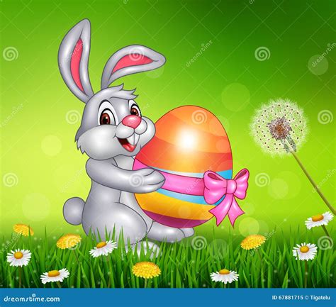 Cute Little Bunny Holding Easter Egg On Grass Background Stock Vector
